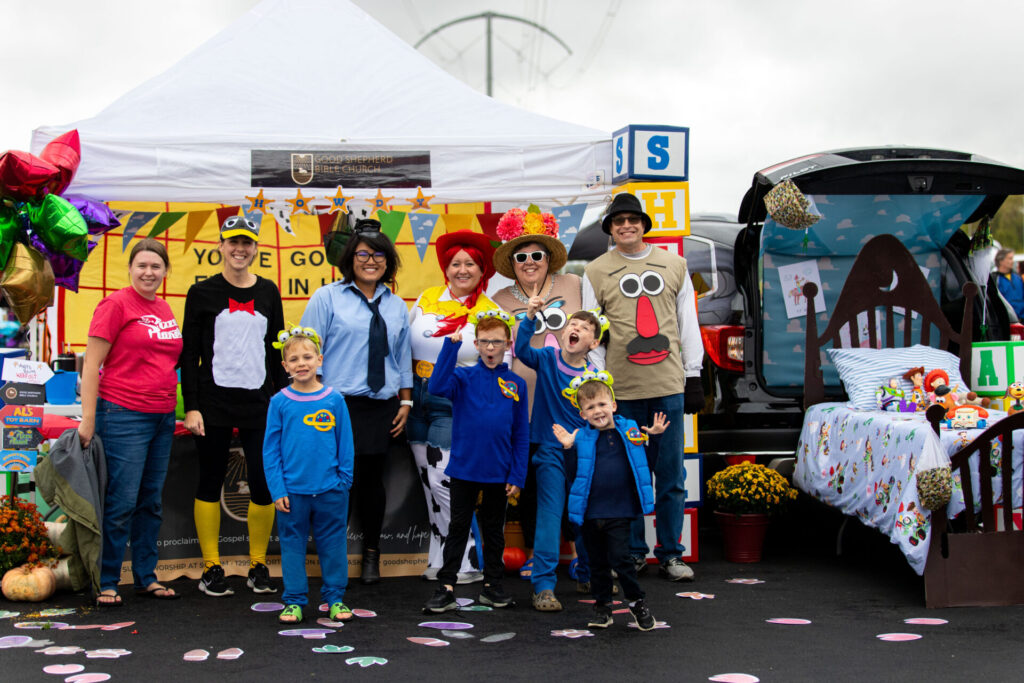 community members dressed up for a trunk or treat event