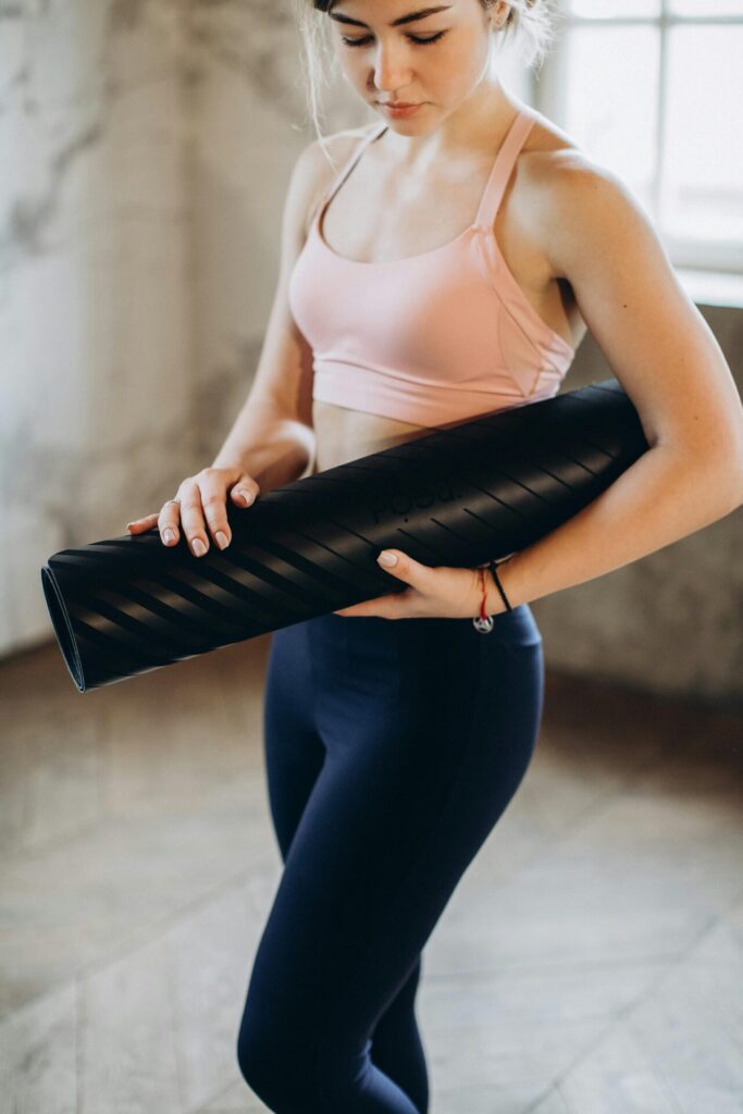 woman with yoga mat