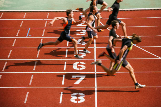 runners crossing the finish line of the track