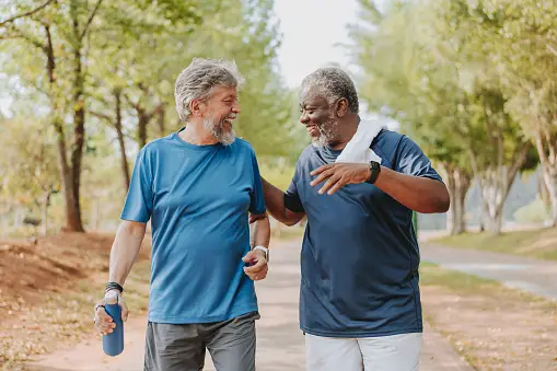 two older men outside exercising